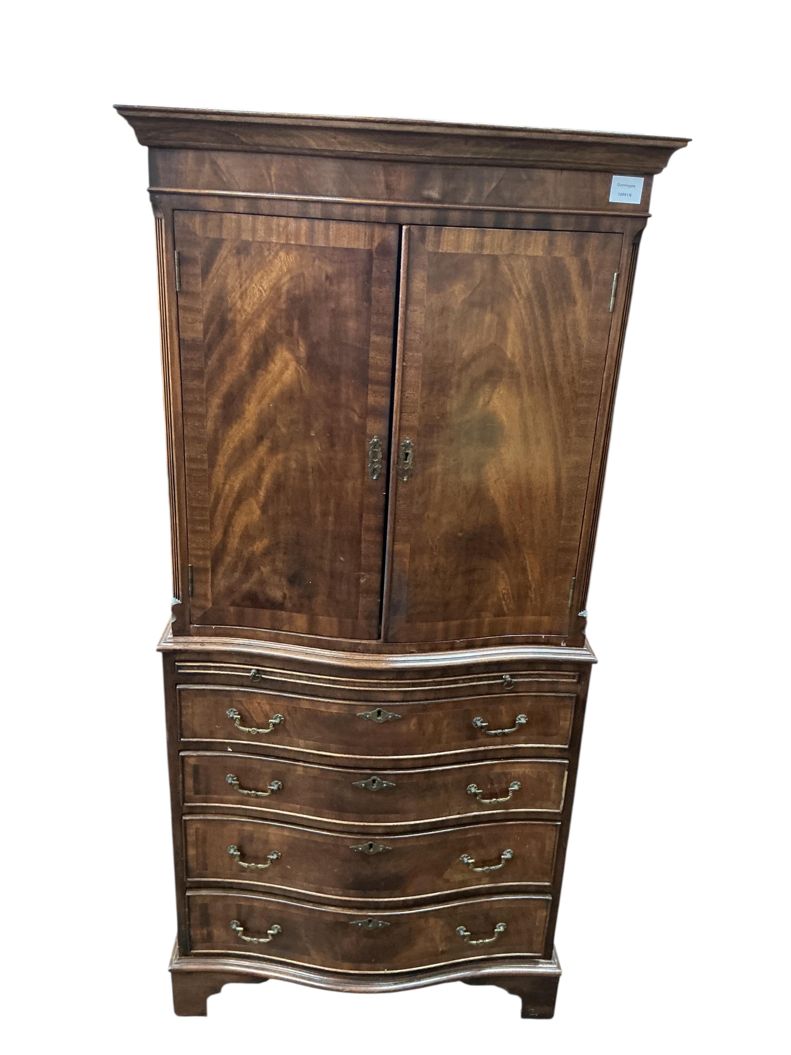 A reproduction George III style serpentine mahogany cocktail cabinet, width 71cm, depth 48cm, height 153cm